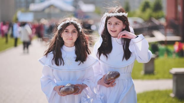 Girls in white dresses after their first holy communion