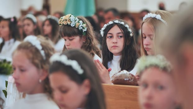 Children in a Catholic church during their first communion