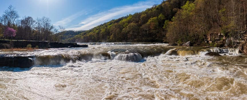 Aerial eye level view of raging water in Tygart river at Valley Falls State Park near Fairmont in West Virginia