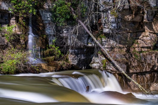 Small waterfall cascade on rocks by Valley Falls State Park near Fairmont in West Virginia on a colorful and bright spring day