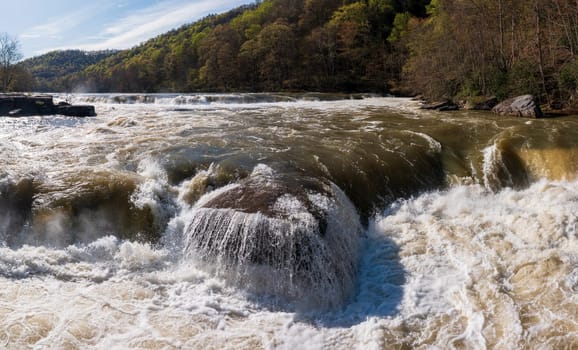 Aerial eye level view of raging water in Tygart river at Valley Falls State Park near Fairmont in West Virginia