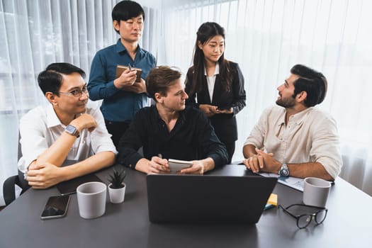 Group of diverse office worker employee working together on strategic business marketing planning in corporate office room. Positive teamwork in business workplace concept. Prudent