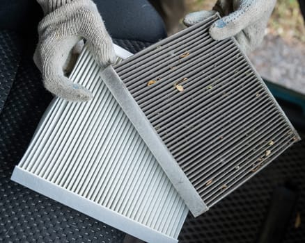 The master changes the cabin air filter of the car