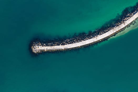 Aerial, nature and sea with footbridge in ocean, bay walk and coastal seaside or pedestrian pathway in summer. Outdoor, ecosystem for marine life and habitat for biology, top view in Mauritius.