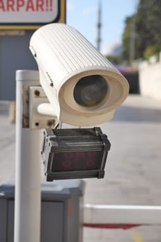 Urban security camera placements near vehicles captured in video footage.