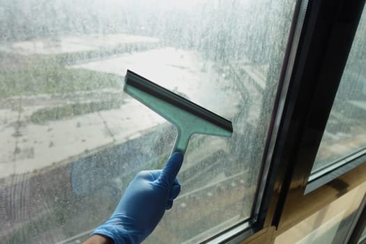 Cleaning windows with a squeegee
