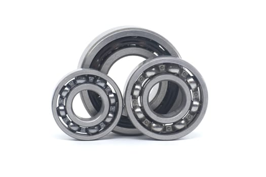 Ball bearings without seal and deep groove ball bearing with steel seal isolated on white background