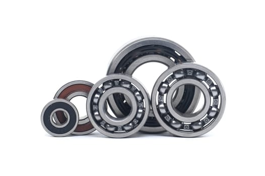 Array of bearings of varying sizes and types, including with and without sealing isolated on a white background