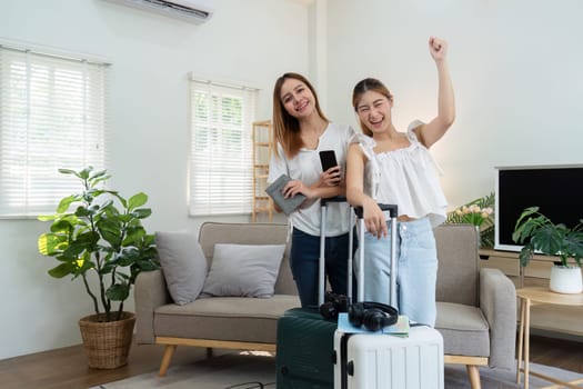 Happy young woman friends with suitcases travel bag luggage for summer holiday weekend tourist vacation trip.