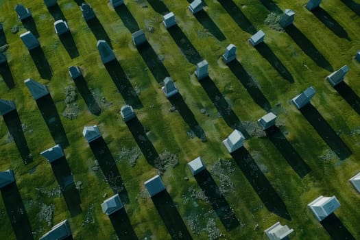 Aerial View of Cemetery Headstones and Grass with Long Shadows