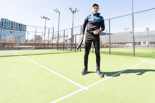 man playing paddle tennis at indoors pitch. High quality photo