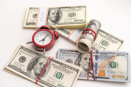 Time is money finance concept with old vintage clocks, dollar bills, spectacles and euro coins. High quality photo