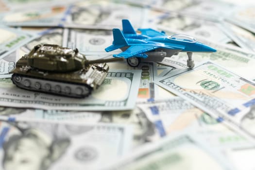 military fighter plane and dollars on a white background. High quality photo