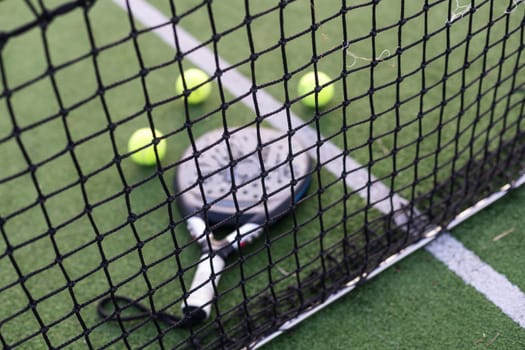 Paddle tennis objects on grass court. High quality photo