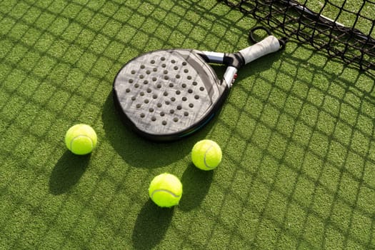 Paddle tennis racket and ball. High quality photo