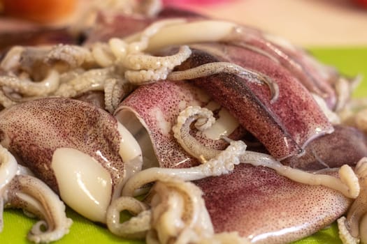 Preparation for Paella: Fresh Calamari Ready for Chopping