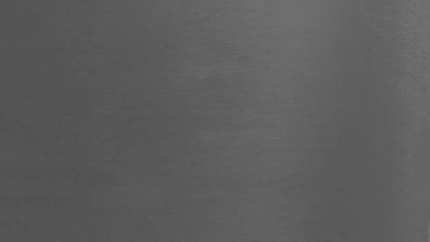Gray wall surface close up. Grey color texture wallpaper,