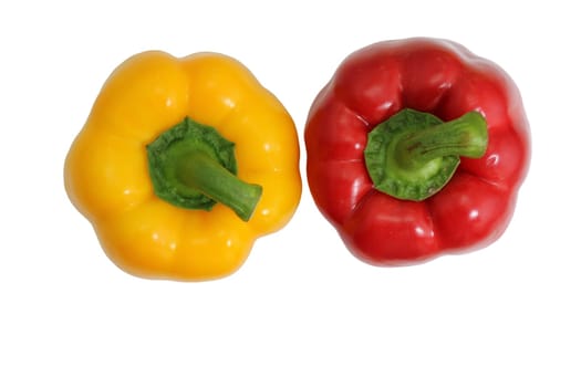 Yellow and red bell peppers on a white background, essential food ingredients.