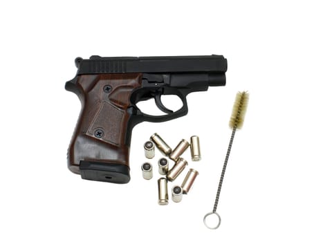 9mm pistol bullets and handgun isolated on white background.