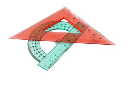 Plastic ruler and pencil on white background.