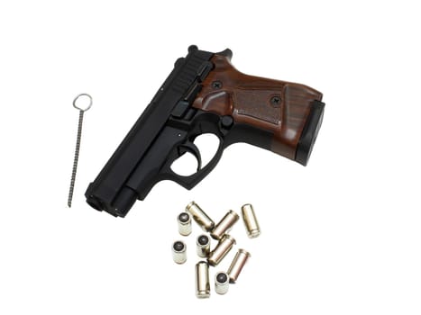 9mm pistol bullets and handgun isolated on white background.