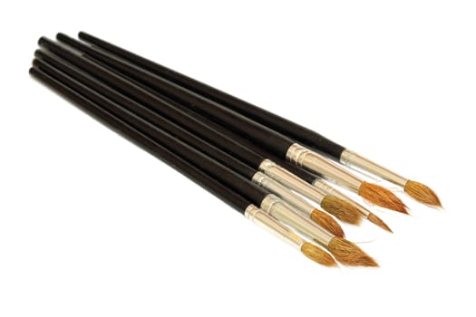 Paint brush with black handle closeup isolated on white background.