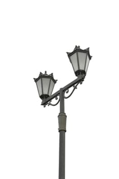 Street light with dual lanterns illuminating the night against a white backdrop.