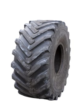 Close up of a tire with intricate tread pattern on white background.