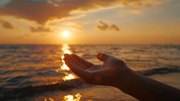 A person is holding out their hand in front of the sun
