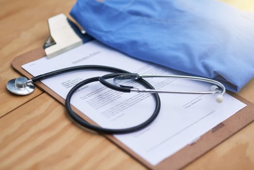 Hospital, clinic and stethoscope with clipboard on desk for medical service, medicine and notes. Healthcare, cardiology and equipment, checklist and tools for medicare, insurance and prescription.