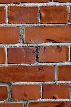 Brick wall, orange and closeup of cement for texture, concrete masonry and pattern in construction. Wallpaper, background and rough design with space for exterior, material and building structure.