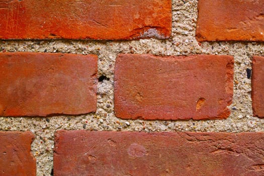 Zoom, red and stone wall for concrete building or structural material for architecture, texture and surface. Brick, masonry and clay or cement to hold or plaster together for construction and design