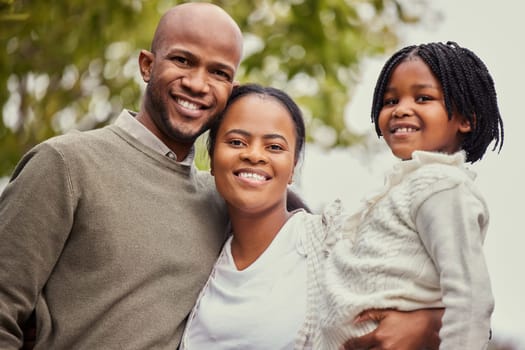 Family, portrait and happy outdoor with smile for home decor, memory and activity together. Father, mother and daughter with happiness or trust in backyard or garden for love, care and child adoption.