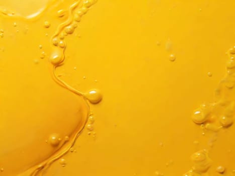 Abstract liquid yellow background.Liquid cream background texture.