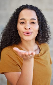 Woman, portrait and blowing a kiss for flirting, love and romance with cute gesture for relationship. Confidence, happy and emoji with lips or mouth, emotion and expression of feelings for affection.