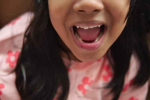 close up of child screaming at home , slow motion