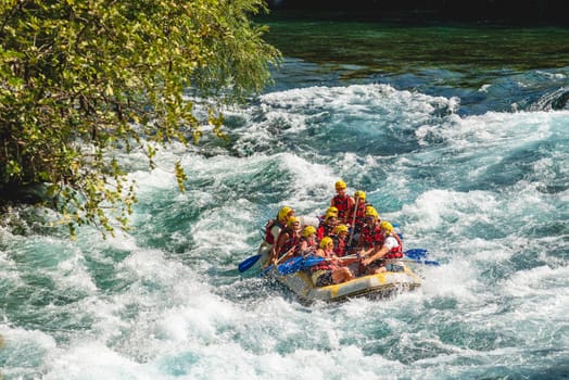 Antalya, Turkey - August 10, 2023: Rafting on a big rafting boat on the river in Antalya Koprulu Canyon.