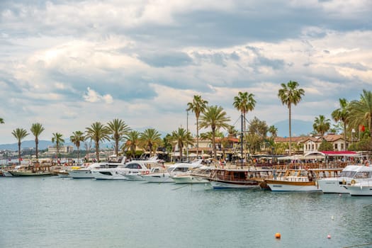 Side, Manavgat, Turkey – April 9, 2024: Sightseeing boats and town square in Side, one of Turkey's unique and historical holiday destinations