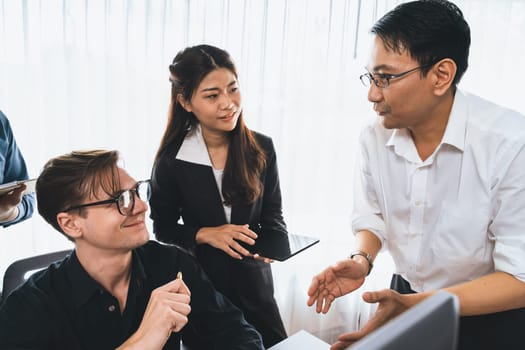 Group of diverse office worker employee working together on strategic business marketing planning in corporate office room. Positive teamwork in business workplace concept. Prudent