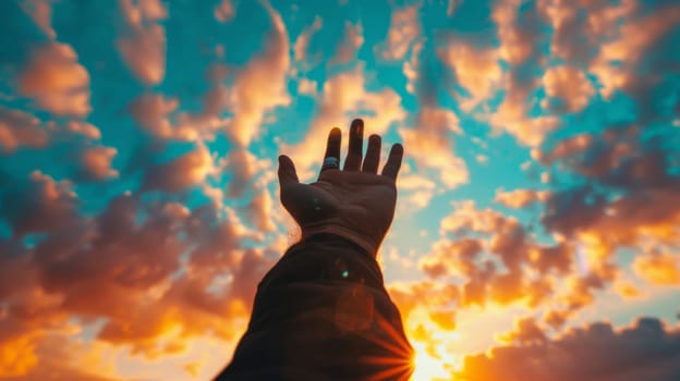 A person reaching up to the sky with their hand