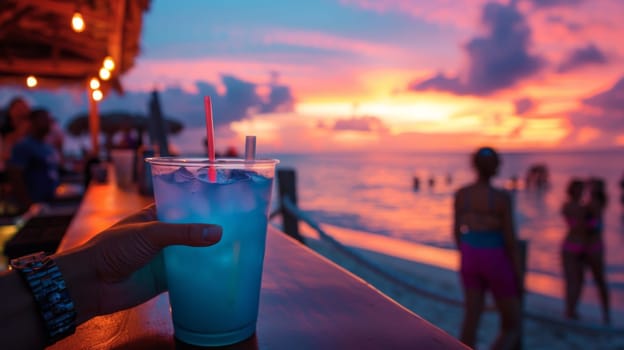 A person holding a drink at the bar on top of a wooden deck