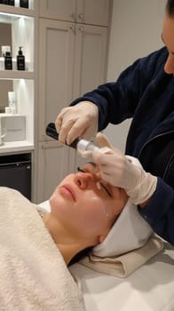 A woman getting a facial treatment in the beauty salon