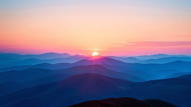 A mountain range with a sunset in the background