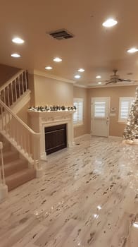 A living room with a fireplace and christmas tree in it