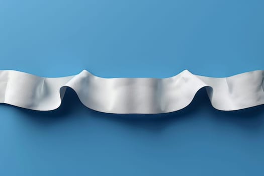 A piece of a roll of toilet paper on top of blue background