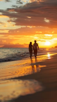 A couple of a man and woman walking on the beach at sunset
