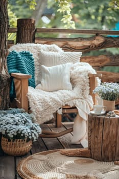 A wooden deck with a chair, table and flowers on it