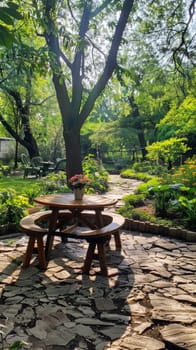 A table and chairs in a park setting with trees