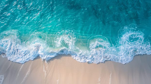An aerial view of a beach with waves and sand