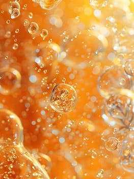 A closeup of bubbles in orange liquid, a key ingredient in this amber fluid commonly used in cuisine. Try incorporating it into your peach dish recipe for a burst of flavor